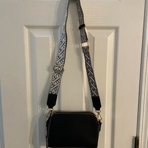 Elegant Black Crossbody Bag with Patterned Strap